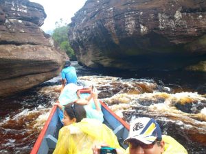 in the boat on the way to the falls